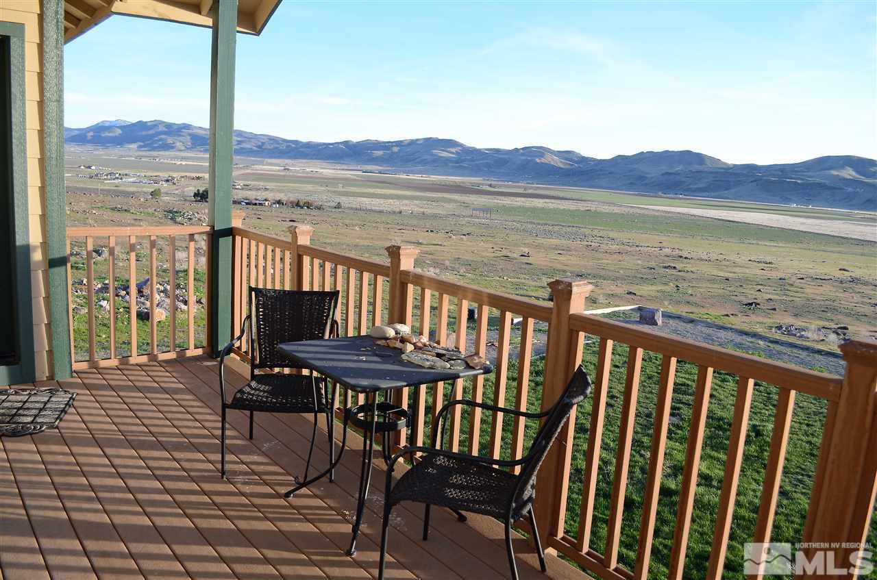 5100 Wayside Road Reno, NV 89510 - Photo 9 of 25 a view of a balcony with chair and wooden floor
