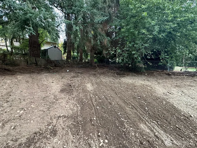 a backyard of a house with lots of green space
