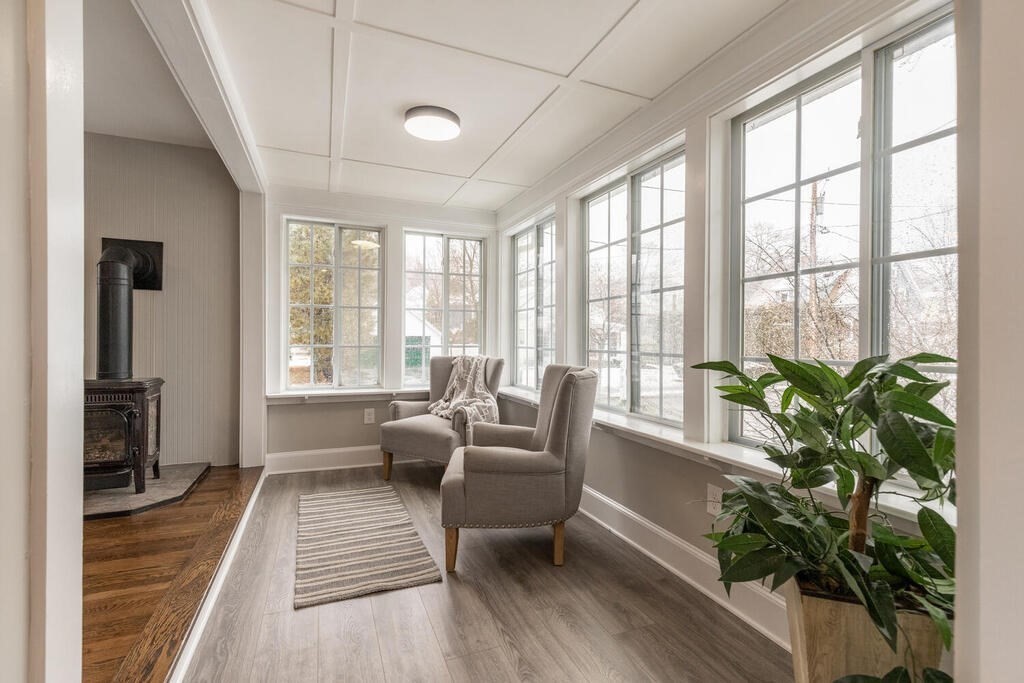 14 Middle Street Wakefield, MA 01880 - Photo 11 of 34 a living room with furniture and a potted plant