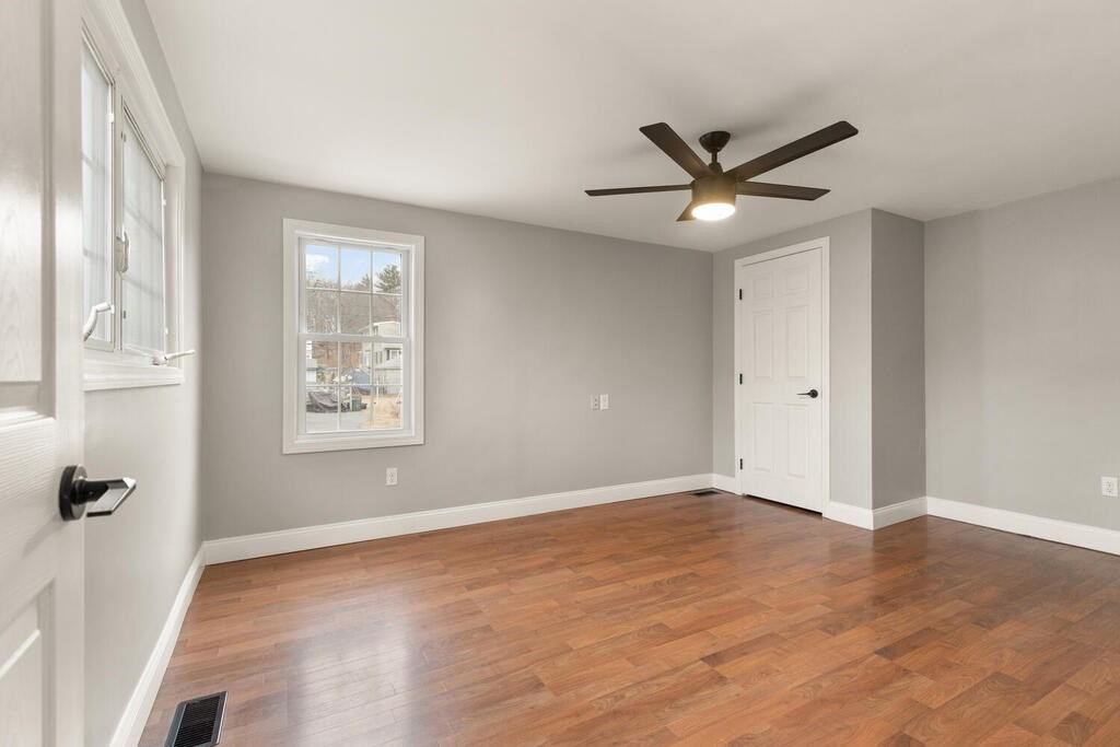 14 Middle Street Wakefield, MA 01880 - Photo 15 of 34 wooden floor in an empty room with a window