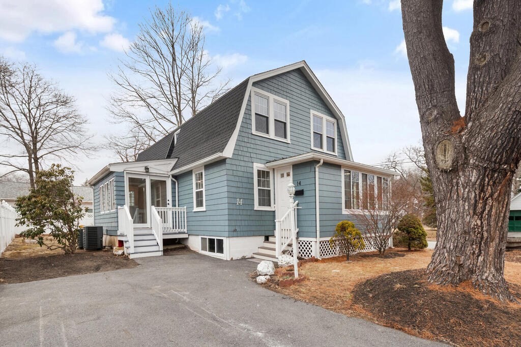 14 Middle Street Wakefield, MA 01880 - Photo 2 of 34 a view of a house with a yard and garage