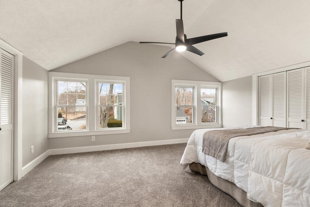 14 Middle Street Wakefield, MA 01880 - Photo 21 of 34 a spacious bedroom with a bed and a large window