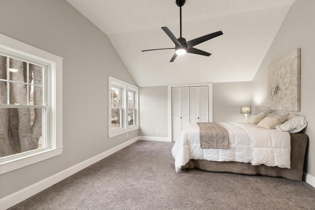 14 Middle Street Wakefield, MA 01880 - Photo 23 of 34 a spacious bedroom with a bed and a window