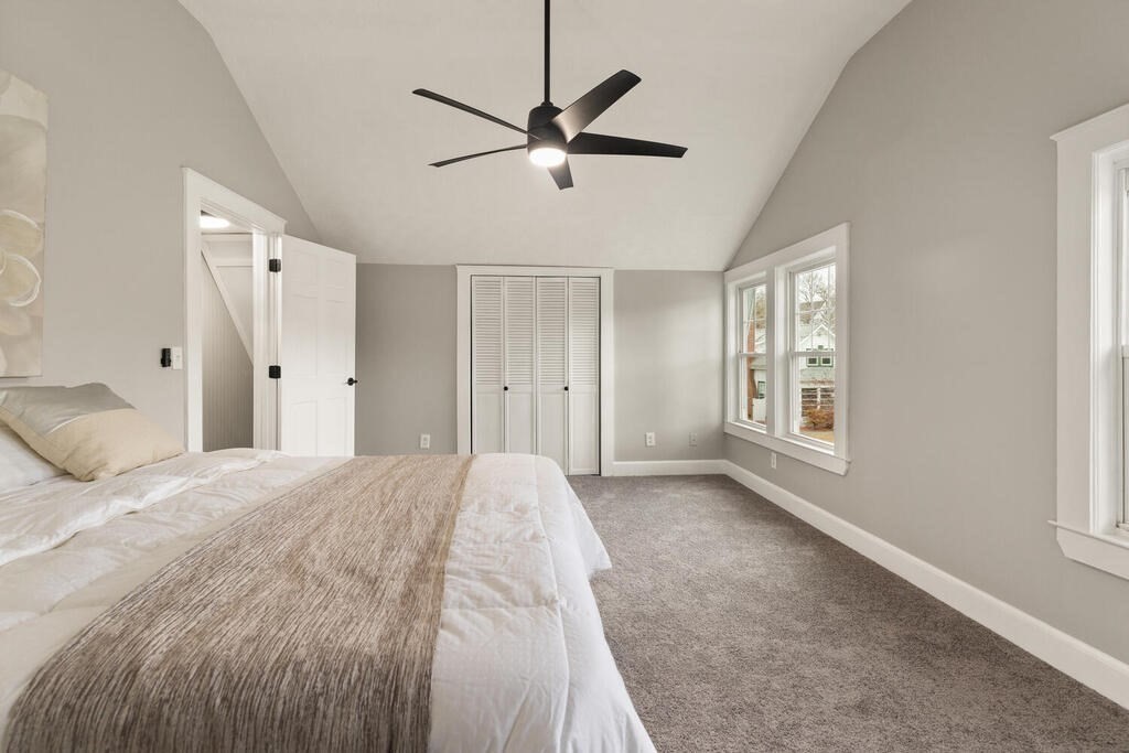 14 Middle Street Wakefield, MA 01880 - Photo 24 of 34 a spacious bedroom with a bed and a window