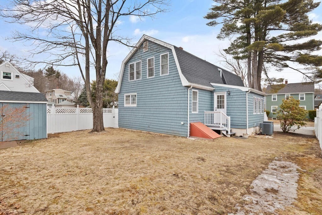 14 Middle Street Wakefield, MA 01880 - Photo 29 of 34 a view of a house with a yard covered in snow