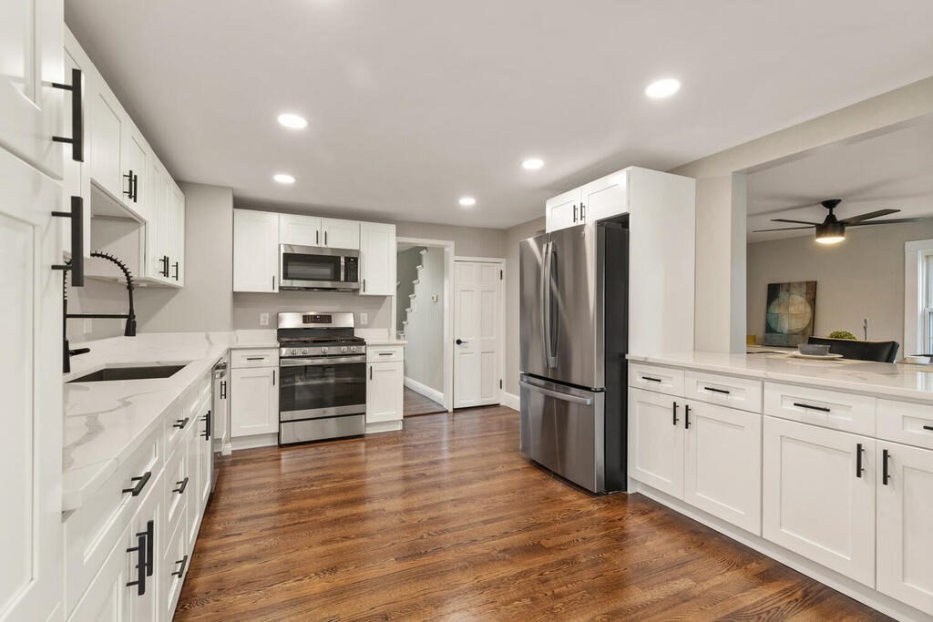 14 Middle Street Wakefield, MA 01880 - Photo 5 of 34 a kitchen with stainless steel appliances a refrigerator sink and microwave