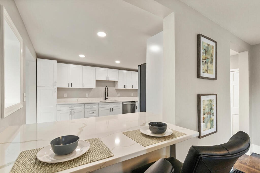 14 Middle Street Wakefield, MA 01880 - Photo 9 of 34 a kitchen with a stove and a dining table