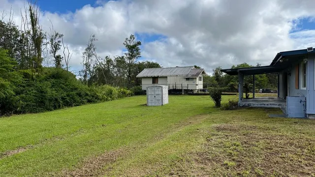 a fire hydrant in the middle of a field