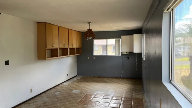 a view of an empty room with a window