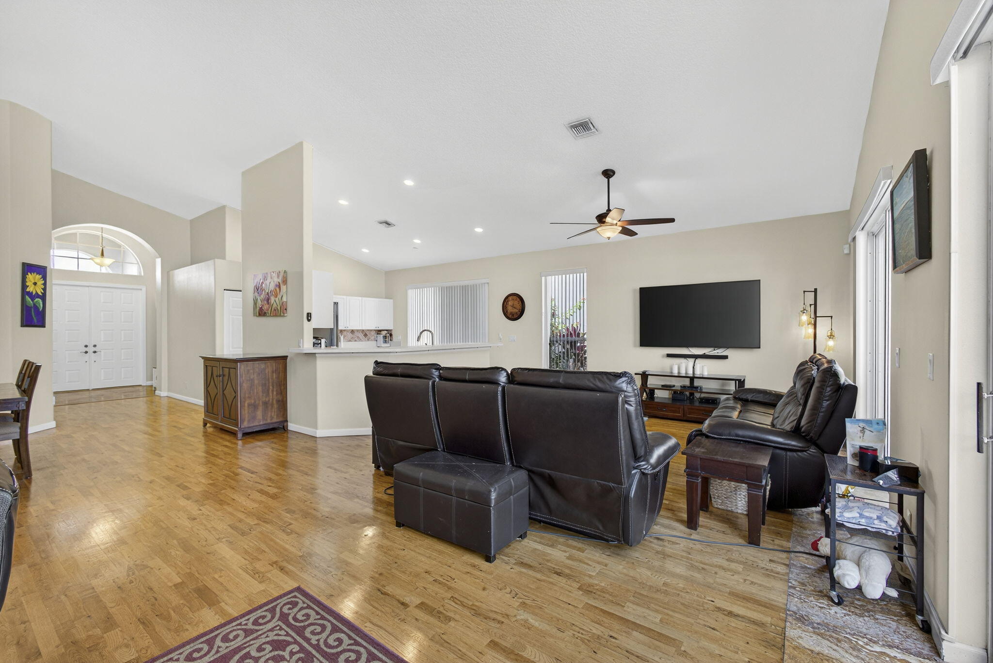 11061 Laurel Walk Road Wellington, FL 33449 - Photo 12 of 67 a living room with furniture and a flat screen tv