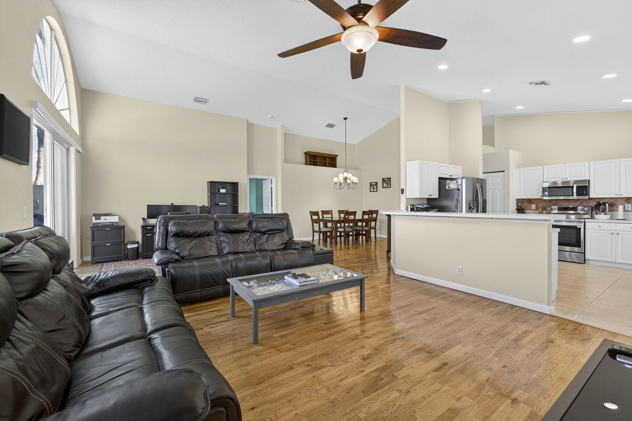 11061 Laurel Walk Road Wellington, FL 33449 - Photo 13 of 67 a living room with furniture wooden floor and a kitchen view