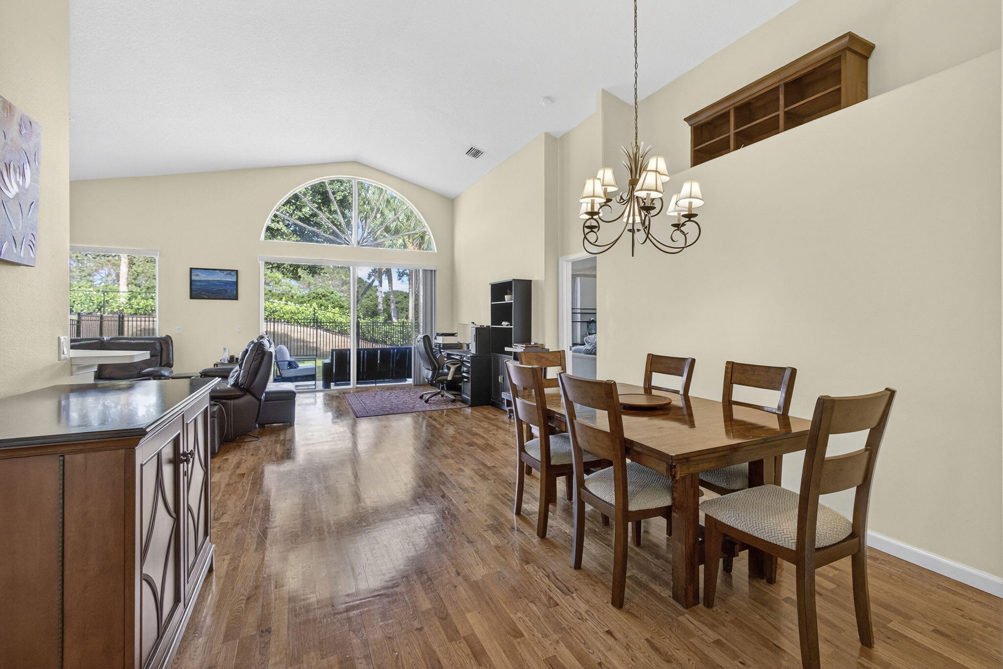 11061 Laurel Walk Road Wellington, FL 33449 - Photo 15 of 67 a view of a dining room with furniture a chandelier and wooden floor
