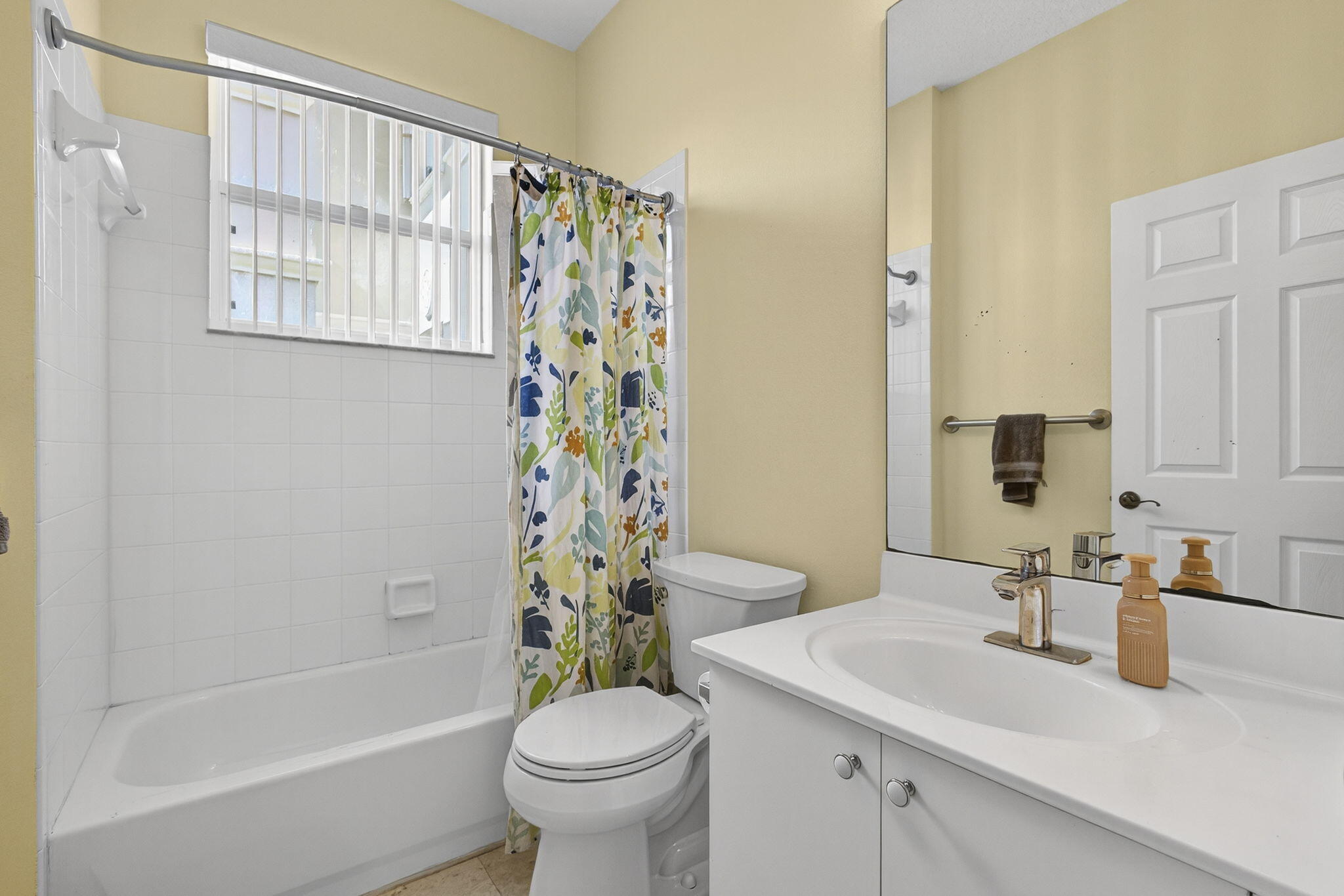 11061 Laurel Walk Road Wellington, FL 33449 - Photo 28 of 67 a bathroom with a sink toilet and shower