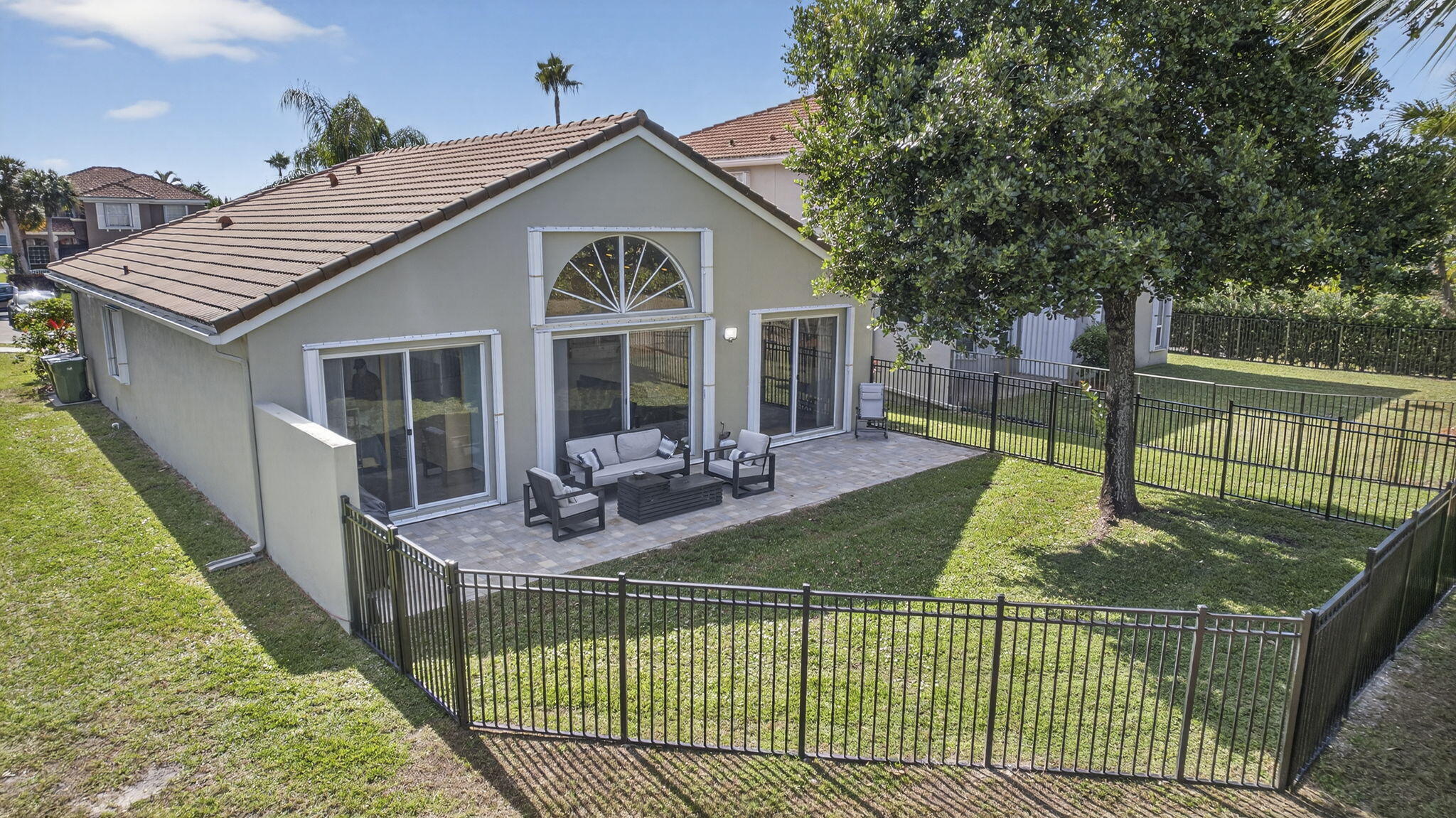 11061 Laurel Walk Road Wellington, FL 33449 - Photo 33 of 67 a view of a house with backyard and sitting area