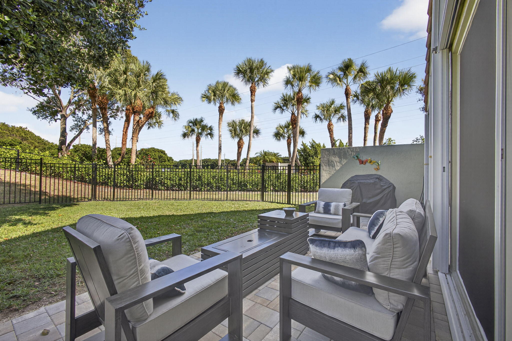 11061 Laurel Walk Road Wellington, FL 33449 - Photo 37 of 67 a view of a patio with couches chairs and a table and chairs