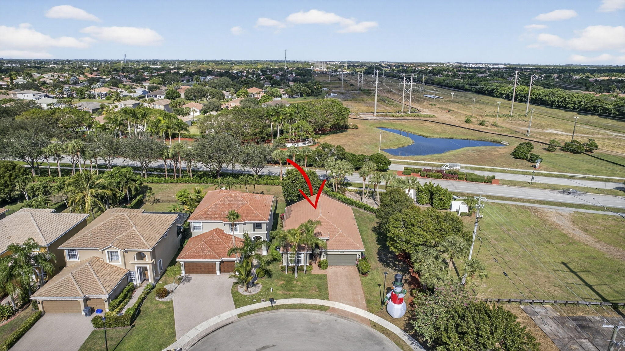 11061 Laurel Walk Road Wellington, FL 33449 - Photo 42 of 67 an aerial view of a house with a lake view