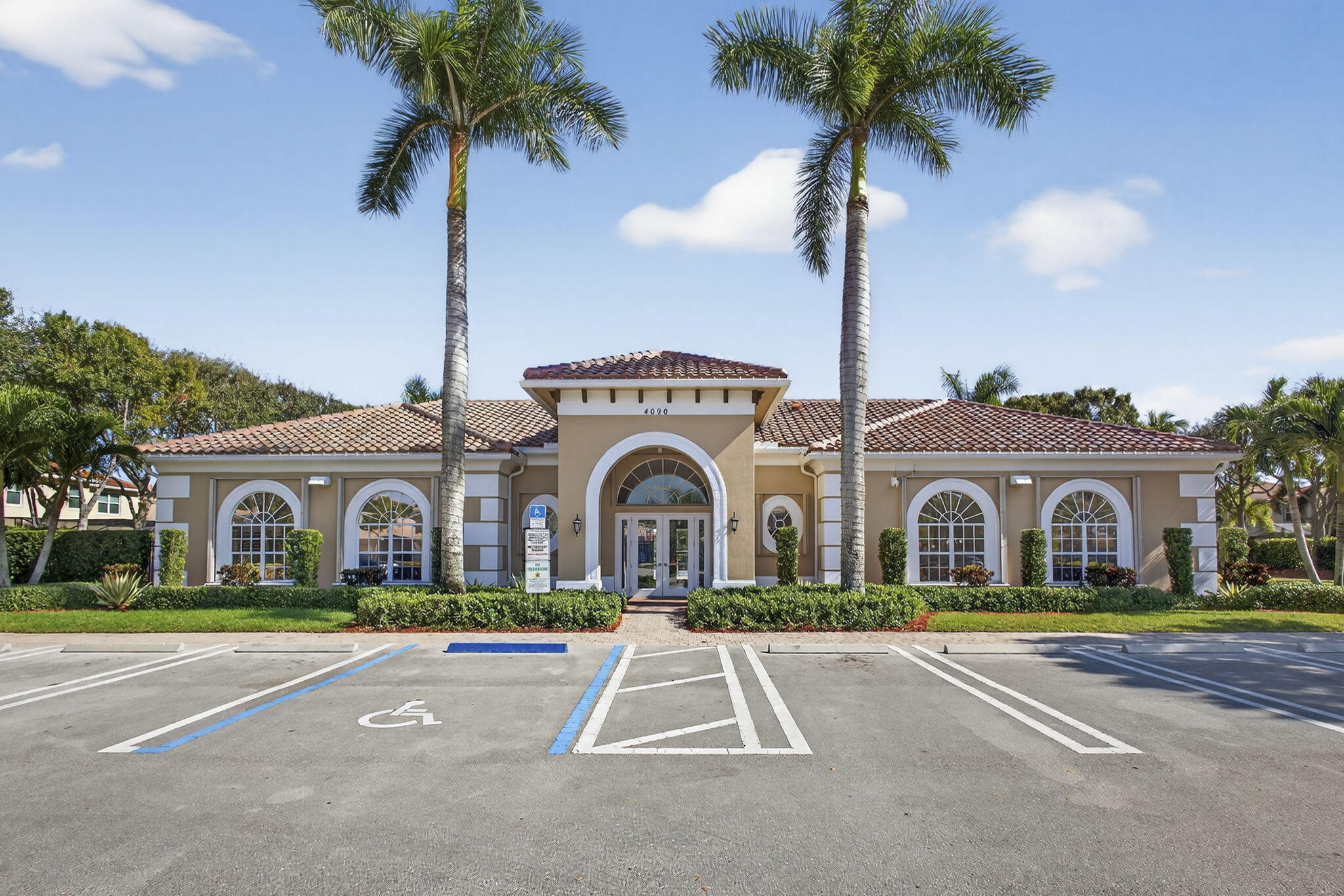 11061 Laurel Walk Road Wellington, FL 33449 - Photo 48 of 67 a view of a house with a yard and palm trees