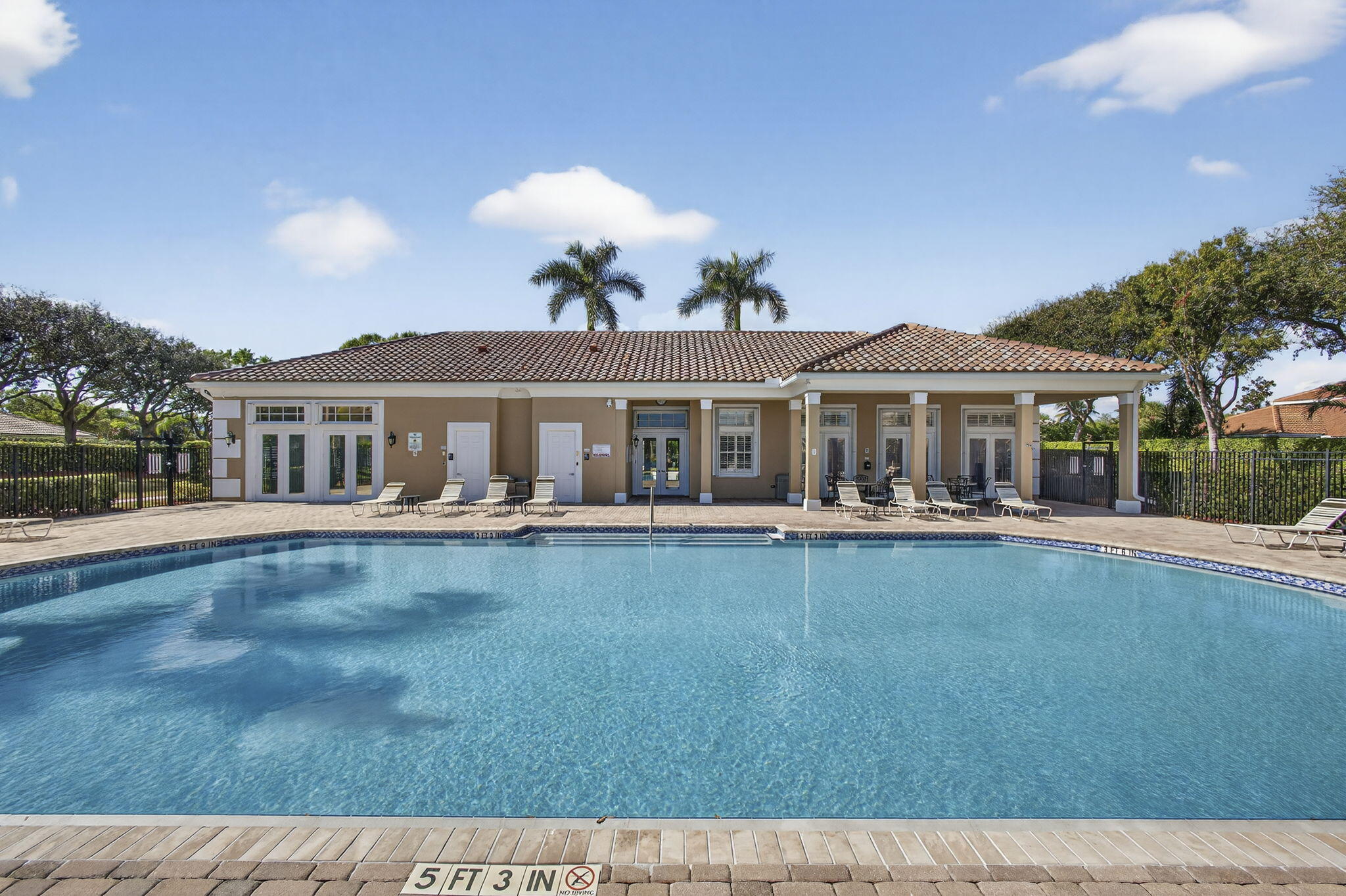 11061 Laurel Walk Road Wellington, FL 33449 - Photo 55 of 67 a front view of a house with swimming pool having outdoor seating