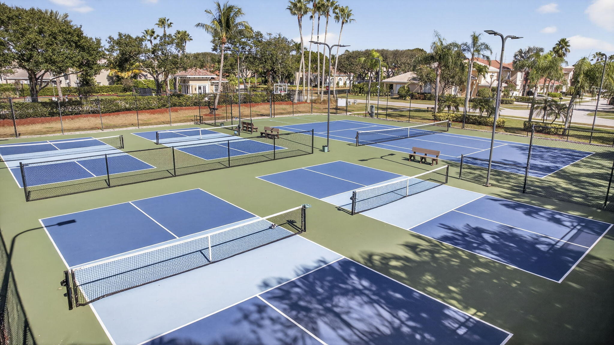 11061 Laurel Walk Road Wellington, FL 33449 - Photo 62 of 67 a view of a tennis ground with large trees