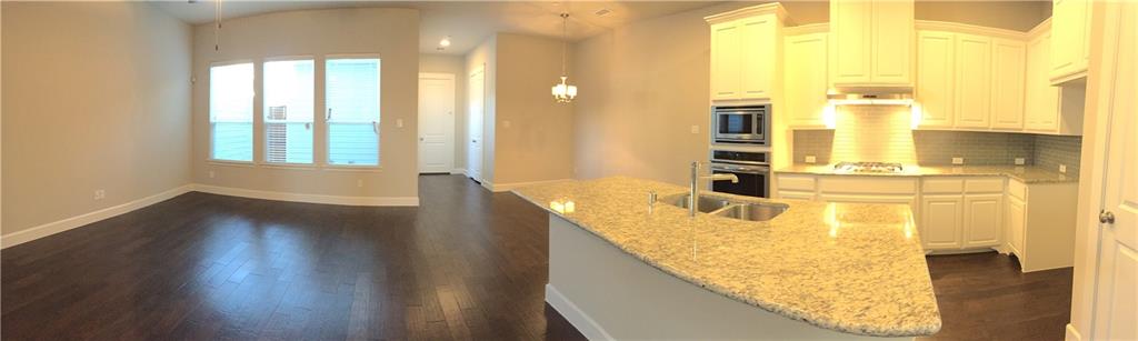 1017 Water Street Carrollton, TX 75007 - Photo 8 of 21 a bathroom with a granite countertop sink and a mirror