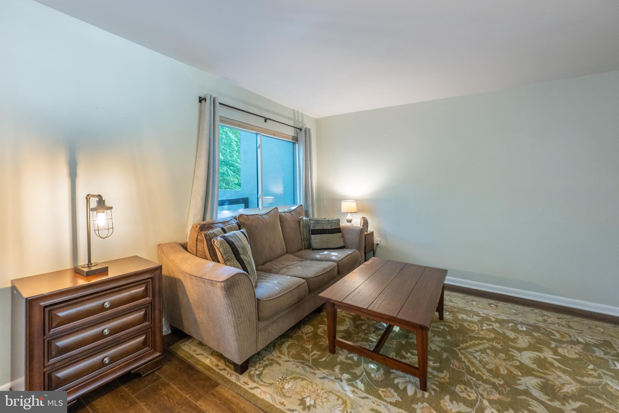 11917 Barrel Cooper Court Reston, VA 20191 - Photo 14 of 59 a living room with furniture and a window