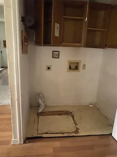 a bathroom with a granite countertop sink