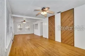 a view of a kitchen and a stove cabinets