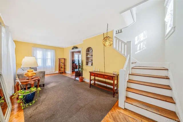 a view of a livingroom with furniture and a staircase