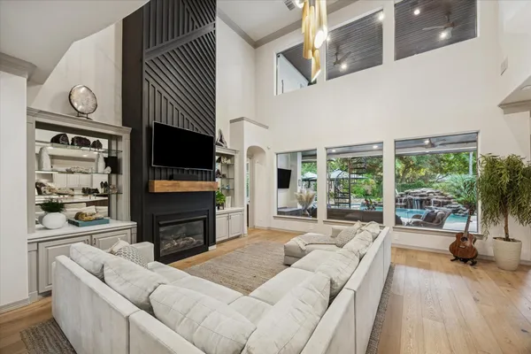 a living room with fireplace furniture and a flat screen tv