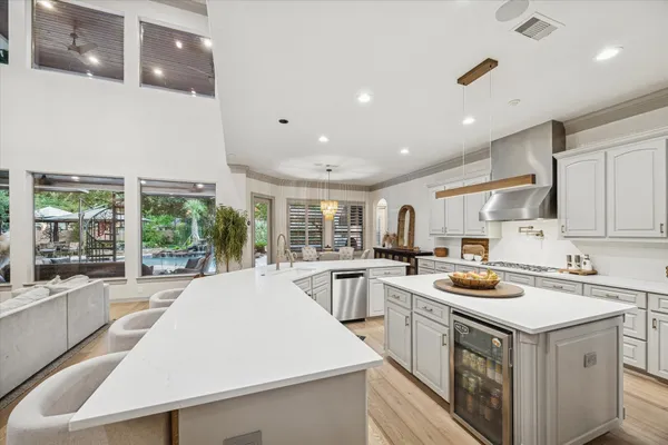 a kitchen that has a sink and a stove in it