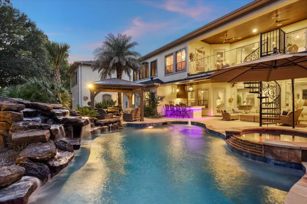 a view of a swimming pool with sitting area