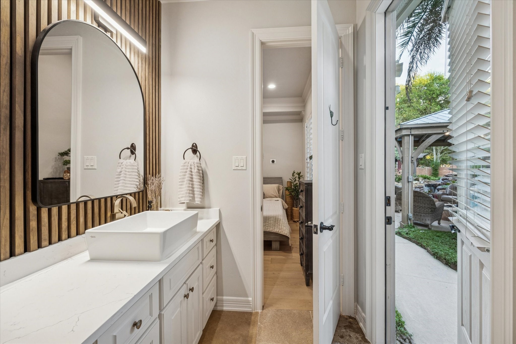 4806 Copper Manor Court Katy, TX 77494 - Photo 23 of 50 a en suite bathroom with a sink and mirror with bathtub