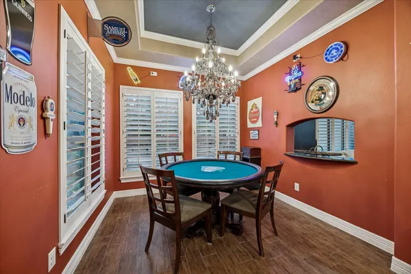 a dining room with furniture and window