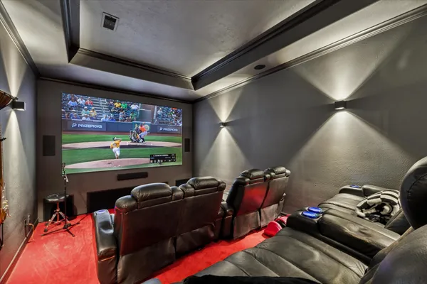 a room with gym equipment and a flat screen tv