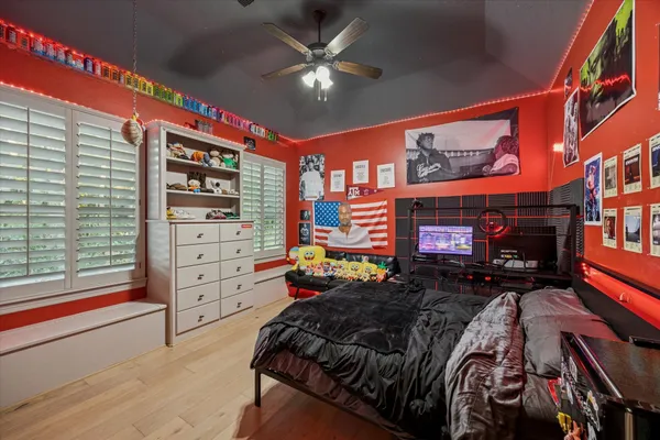 a bedroom with furniture and a chandelier