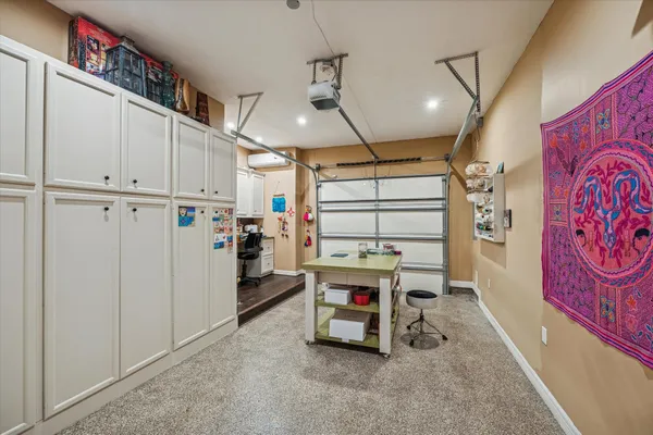 a utility room with multiple dryer and washer