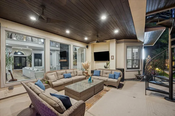 a living room with furniture and a flat screen tv