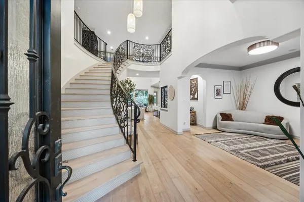 a bedroom with furniture and a rug