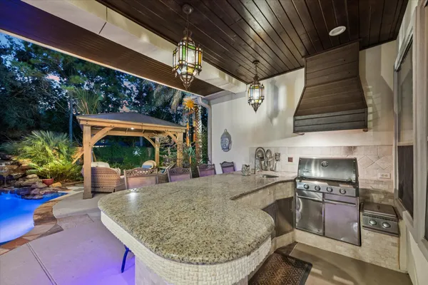 a view of a kitchen with furniture and a fireplace