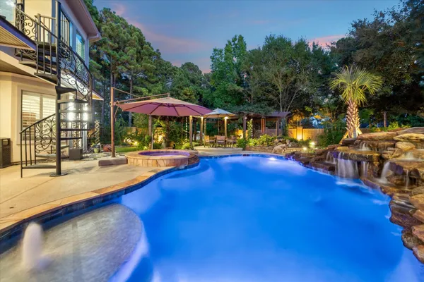a swimming pool with outdoor seating and yard