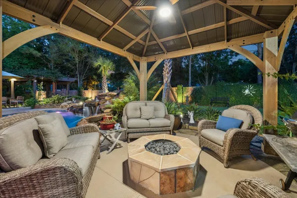 a outdoor space with patio the couches and a potted plant on dining table and chairs