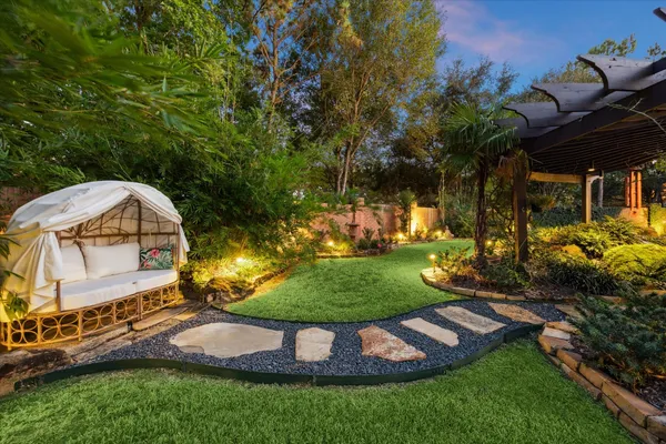 a view of a backyard with a fountain