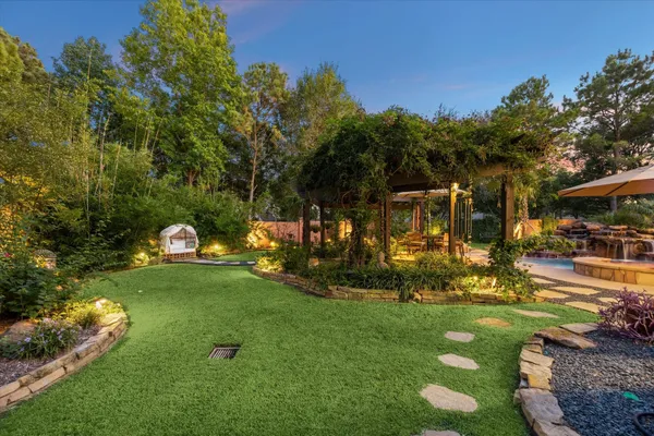 a view of a park with large trees