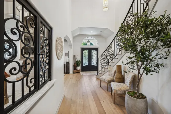 a view of entryway with furniture and stairs