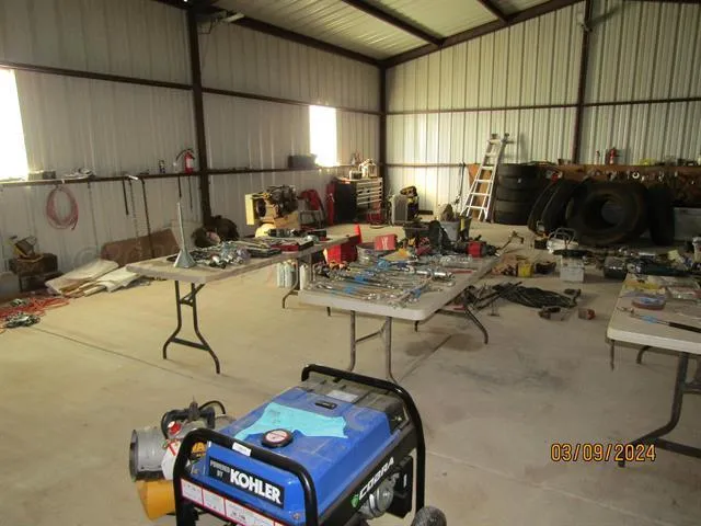 a room with gym equipment and a table
