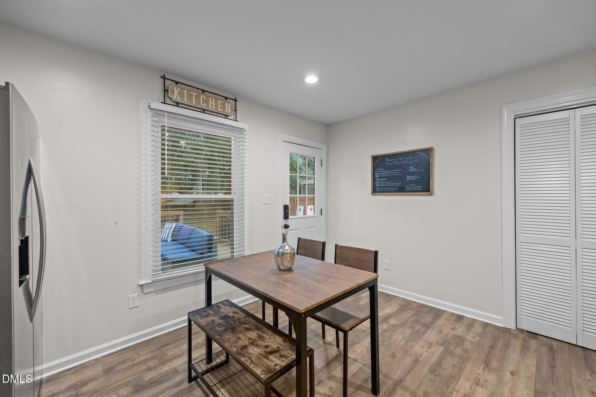 2752 Milburnie Road Raleigh, NC 27610 - Photo 17 of 54 a view of a dining room with furniture window and wooden floor