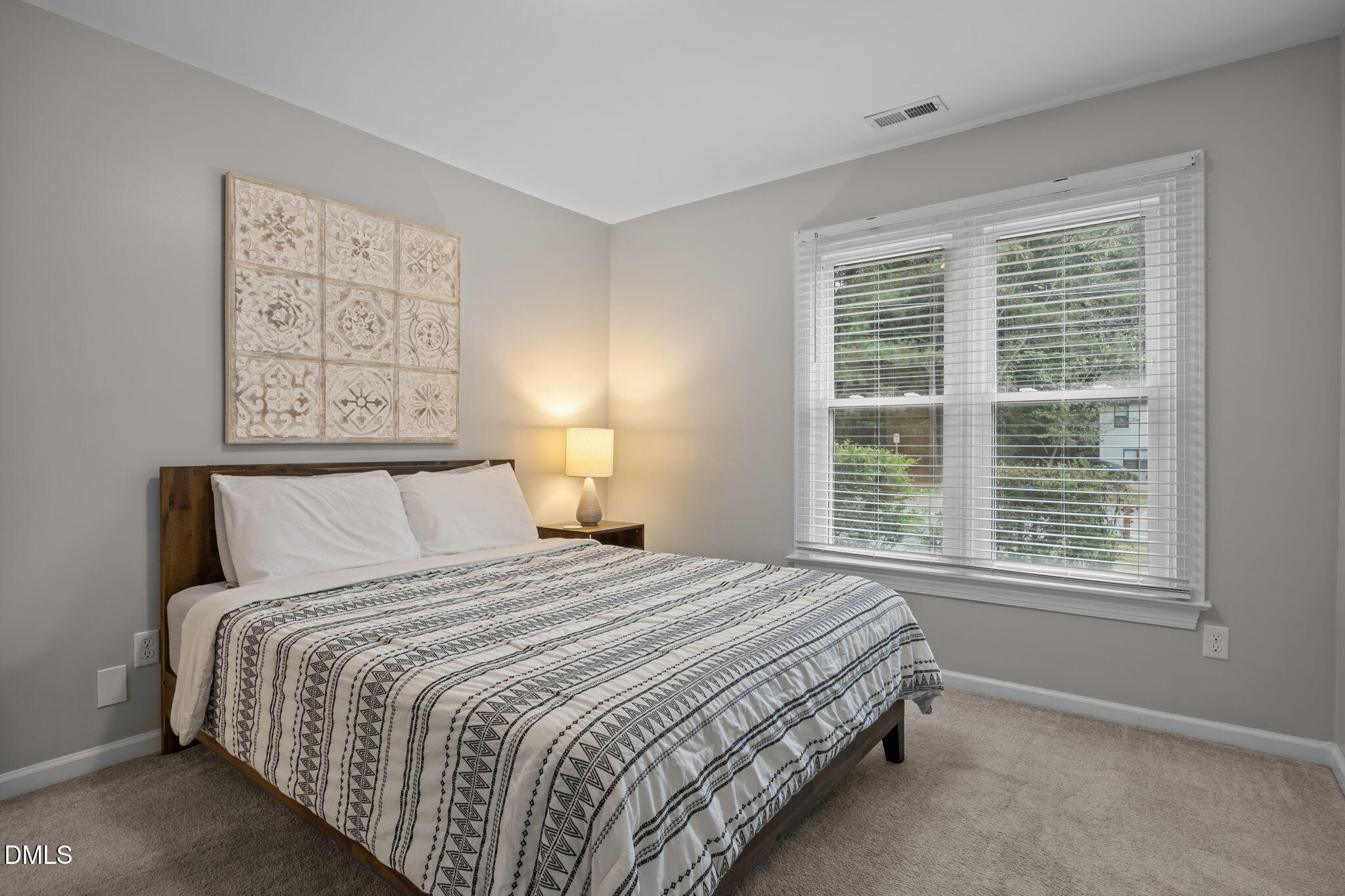 2752 Milburnie Road Raleigh, NC 27610 - Photo 24 of 54 a bedroom with a bed and a window
