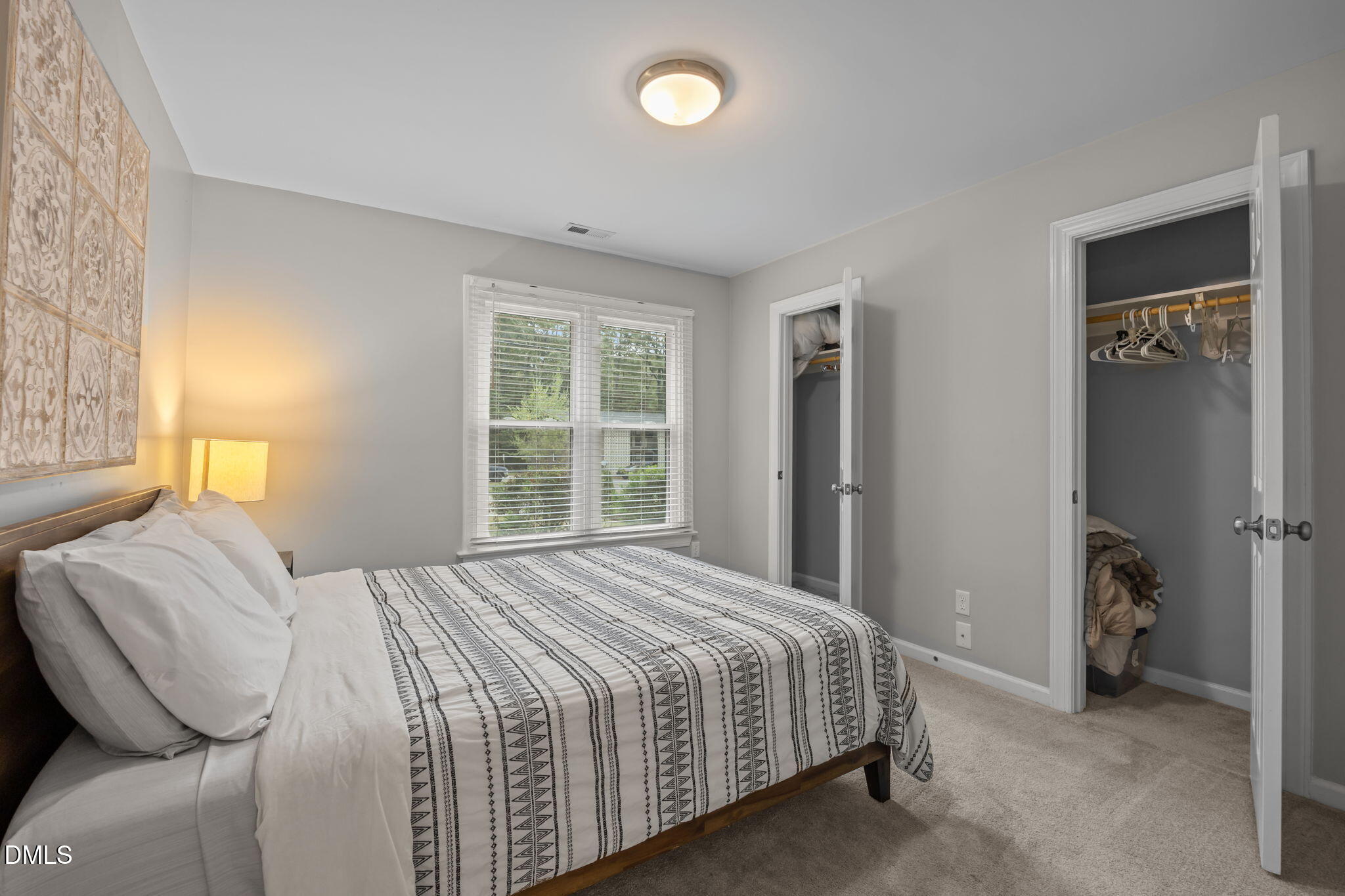 2752 Milburnie Road Raleigh, NC 27610 - Photo 26 of 54 a bedroom with a bed and a window