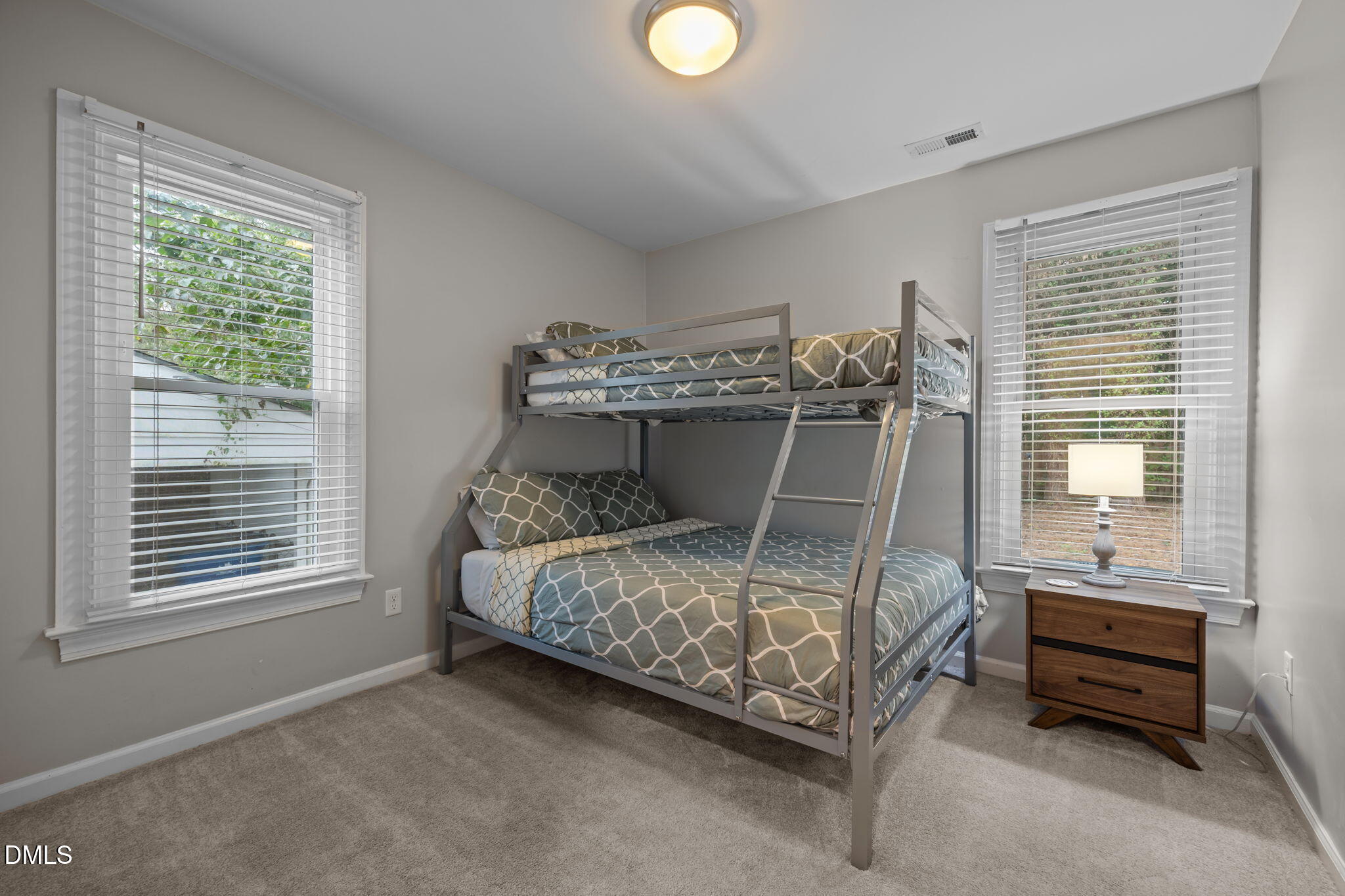 2752 Milburnie Road Raleigh, NC 27610 - Photo 27 of 54 a bedroom with a bed and a window