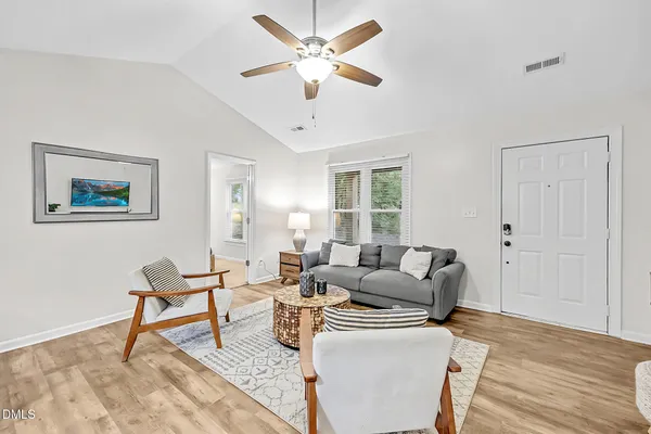 a living room with furniture and a window